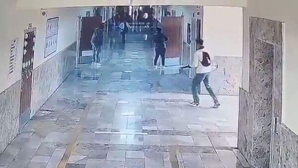 An armed person walks down a school corridor in Siverek, Sanliurfa province, Turkey, April 14, 2026, in this still image obtained from a social media video. Social Media/via REUTERS