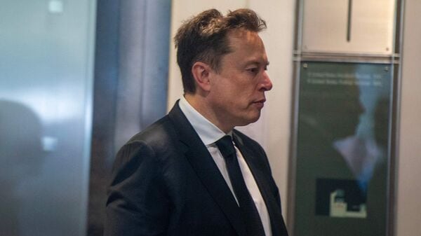 Elon Musk arrives at the federal courthouse as opening statements begin in the trial over Elon Musk's lawsuit against OpenAI in Oakland, California, on April 28, 2026. (Photo by Karl Mondon / AFP)