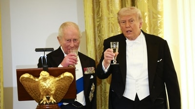 US President Donald Trump and Britain's King Charles III raise a toast during a State Dinner in the East Room of the White House in Washington, DC, on April 28, 2026. (Photo by Henry Nicholls / AFP) (AFP)