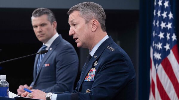 (L/R) US Secretary of Defense Pete Hegseth looks on as Chairman of the Joint Chiefs of Staff General Dan Caine speaks during a press briefing at the Pentagon in Washington, DC, on April 16, 2026.  (Photo by SAUL LOEB / AFP)