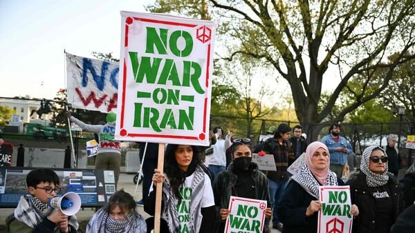 Protestors rally against US military action in Iran during a demonstration near the White House in Washington, DC, on April 7, 2026.