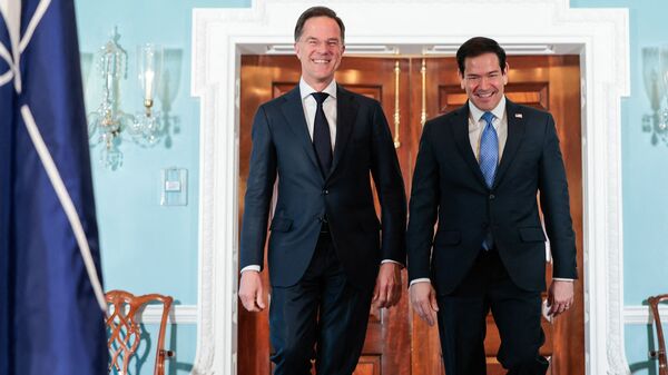 NATO Secrertary General Mark Rutte and US Secretary of State Marco Rubio speak with each other as they meet at the State Department in Washington, DC, on April 8, 2026. Rutte has a scheduled meeting with US President Donald Trump later in the day at the White House.