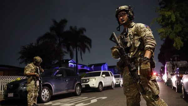 An FBI tactical team prepares to enter a house associated with the suspected White House Correspondents' Dinner shooter in Torrance, California, on April 25, 2026. US President Donald Trump said April 25 he would give a press conference from the White House press briefing room, shortly after a shooting incident at a gala dinner in Washington. The press conference is set to take place shortly after 10 p.m. (0200 GMT), Trump wrote on his Truth Social platform, adding: 'The First Lady, plus the Vice President, and all Cabinet members, are in perfect condition.'