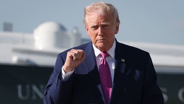 US President Donald Trump walks toward reporters before answering questions prior to boarding Air Force One on April 10, 2026 at Joint Base Andrews, Maryland. President Trump is traveling to Charlottesville, Virginia.