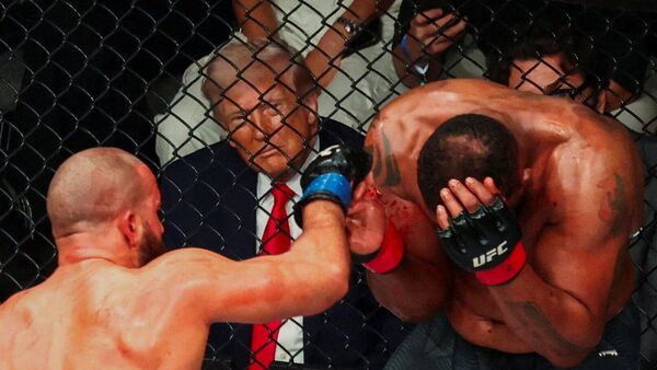 U.S. President Donald Trump watches a match during the UFC 327 event at Kaseya Center in Miami, Florida, U.S., April 11, 2026.