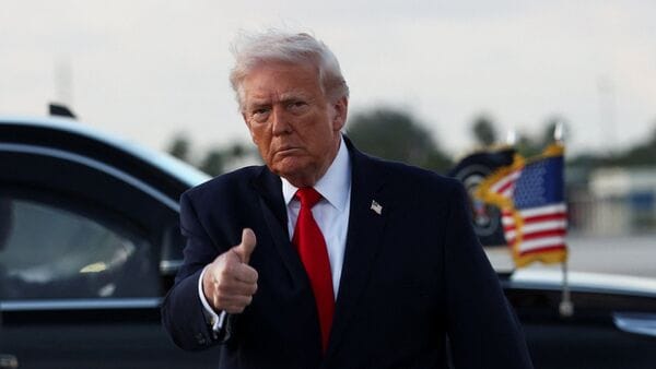 U.S. President Donald Trump gives a thumbs up as he arrives at Miami International Airport in Florida, U.S., April 11, 2026.  REUTERS/Kevin Lamarque