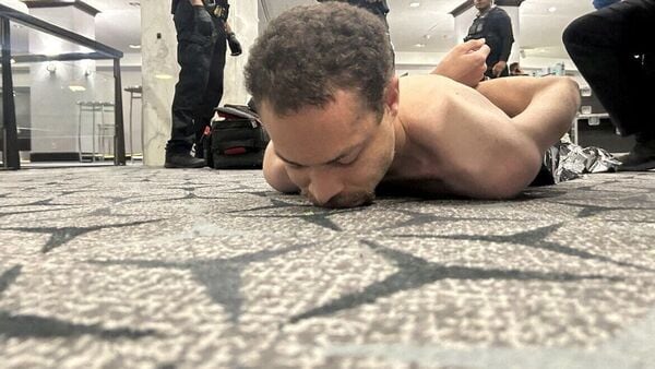 Law enforcement personnel detain Cole Tomas Allen, a suspect in the shooting incident at the White House Correspondents' Association dinner, in Washington, D.C., U.S. April 25, 2026.