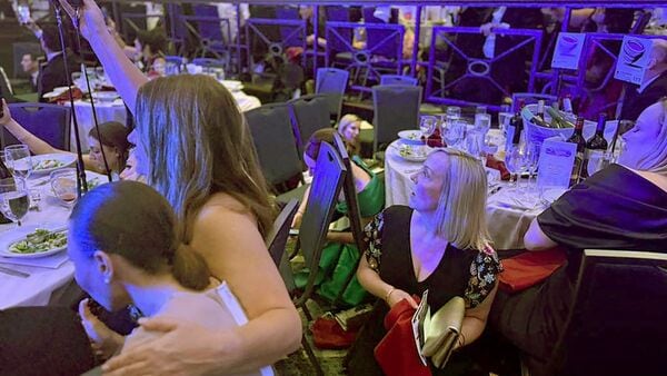 White House dinner shooting LIVE: Guests watch from tables after U.S. President Donald Trump and first lady Melania Trump were rushed out of the White House Correspondents' Association dinner by Secret Service agents after a loud, unidentified noise, in Washington, D.C., U.S. April 25, 2026.  REUTERS/Jessica Koscielniak