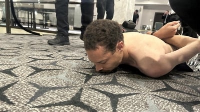 Law enforcement personnel detain Cole Tomas Allen, suspect in the shooting incident at the White House Correspondents' Association dinner, in Washington, D.C., U.S. April 25, 2026. (via REUTERS)