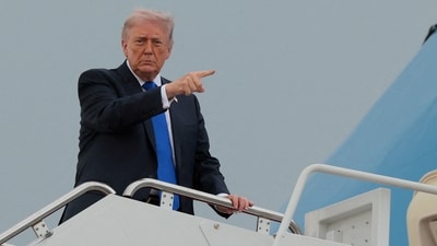 US President Donald Trump boards Air Force One en route to Palm Beach International Airport. (REUTERS)