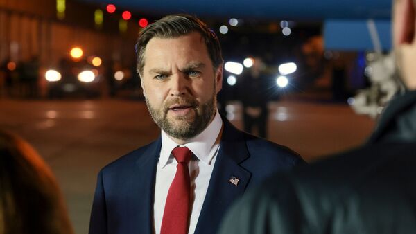 Vice President JD Vance speaks to reporters before boarding Air Force Two to return to Washington, at Budapest Ferenc Liszt International Airport in Budapest, Hungary, Wednesday, April 8, 2026. (Jonathan Ernst/Pool via AP)