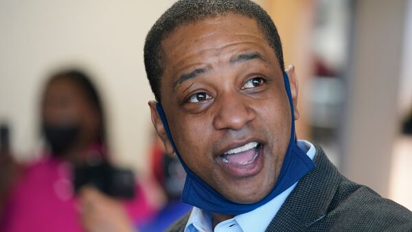 FILE - Virginia Lt. Gov. Justin Fairfax, speaks to supporters at Pink Fish restaurant in Hampton, Va., Thursday, April 8, 2021.  (AP Photo/Steve Helber, File)