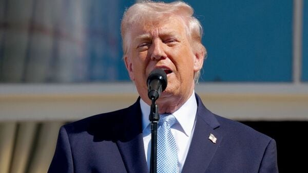 US President Donald Trump speaks on the Blue Room balcony during the Easter Egg Roll on the South Lawn of the White House in Washington, DC, US, on Monday, April 6, 2026. The theme of the 2026 Easter egg roll is celebrating the country's 250th anniversary. Photographer: Aaron Schwartz/CNP/Bloomberg
