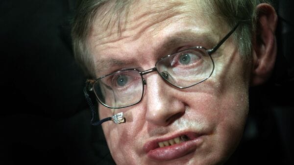 Professor Stephen Hawking poses after the unveiling of his statue at the Centre for Mathematical Sciences, at Cambridge University, in Cambridge, U.K., on Wednesday, Dec. 19, 2007. The event marks the opening of the University's Centre for Theoretical Cosmology (CTC) at the Department of Mathematics and Applied Physics. Photographer: Graham Barclay/Bloomberg News