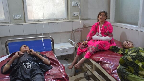 Children who were injured after a truck carrying Afghan refugees returning from Pakistan overturned on a highway in the Laghman province, and later evacuated to hospital, in Jalalabad city, Afghanistan Saturday, May 30, 2026