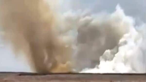 This still image taken from video shows a plume of smoke rises above the plain near Mountain Home Air Force Base, Idaho, where two Navy jets collided at an air show