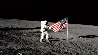 Astronaut Charles Conrad Jr., Apollo 12 commander, stands beside the United States flag after it was unfurled on the lunar surface during the first extravehicular activity (EVA), on Nov. 19, 1969. (NASA)