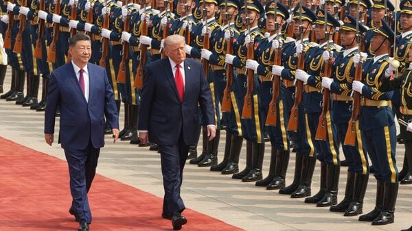 US President Donald Trump participates in a welcome ceremony with China's President Xi Jinping at the Great Hall of the People