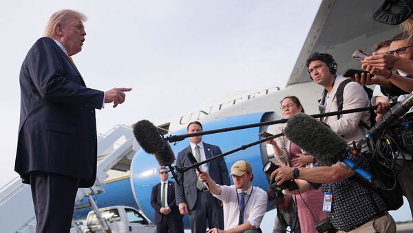 US President Donald Trump addressing reporters at Palm Beach International Airport in West Palm Beach before taking off for Miami on May 2, 2026.