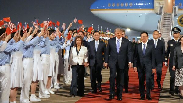 President Donald Trump walks with China's Vice President Han Zheng during a welcome ceremony