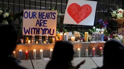 San Diego shooting: Candles and signs are placed on the ground as people pay their respects in front of the Islamic Center of San Diego after the vigil in a park, the day after a fatal shooting incident, in San Diego, California, U.S., May 19, 2026. REUTERS/Daniel Cole (REUTERS)
