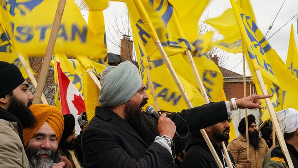People protest in support of Khalistan outside of the Triveni Mandir Hindu temple, in Brampton, Ontario, Sunday, April 5, 2026. (Arlyn McAdorey/The Canadian Press via AP)
