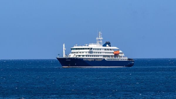 A general view of the cruise ship MV Hondius stationary off the port of Praia, the capital of Cape Verde, on May 3, 2025. (Photo by AFP)