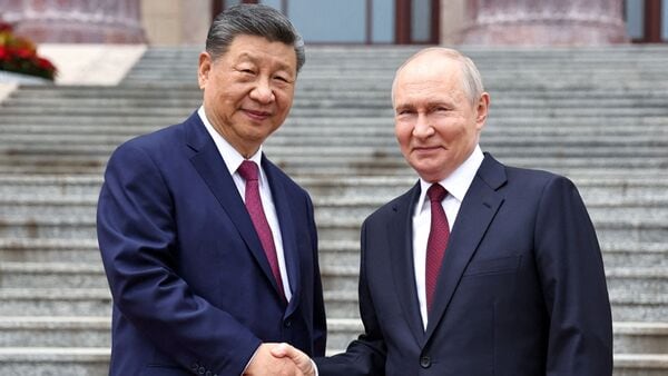 Russian President Vladimir Putin shakes hands with Chinese President Xi Jinping during a welcoming ceremony at the Great Hall of the People in Beijing, China May 20, 2026. (Sputnik/Alexander Kazakov/Pool via REUTERS)