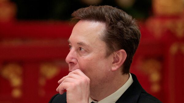 Tesla CEO Elon Musk attends a state banquet with U.S. President Donald Trump and Chinese President Xi Jinping at the Great Hall of the People in Beijing, China, May 14, 2026. REUTERS/Evan Vucci