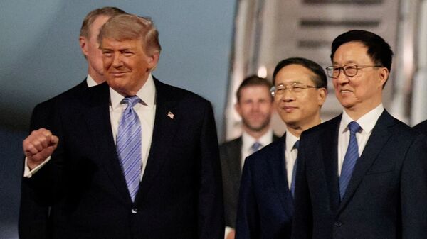 U.S. President Donald Trump participates in an arrival ceremony at Beijing Capital International Airport during his visit to the country, in Beijing, China, May 13, 2026. REUTERS/Evan Vucci