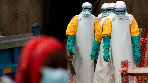 Health workers dressed in protective gear begin their shift at an Ebola treatment center in Beni, Congo, July 16, 2019.