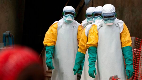 Health workers dressed in protective gear begin their shift at an Ebola treatment center in Beni, Congo, July 16, 2019.