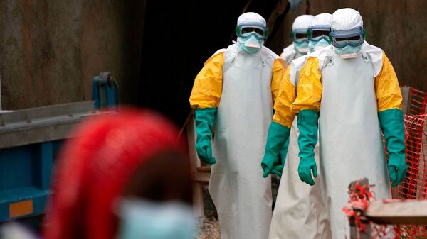 Health workers dressed in protective gear begin their shift at an Ebola treatment centre in Beni, Congo.