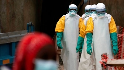 FILE - Health workers dressed in protective gear begin their shift at an Ebola treatment center in Beni, Congo, July 16, 2019. (AP Photo/Jerome Delay, File) (AP Photo/Jerome Delay)