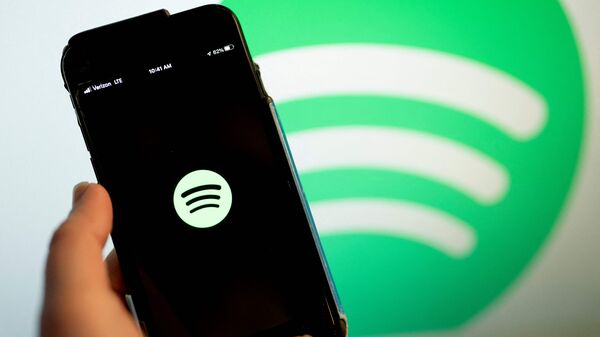 In this file illustration photo taken on February 3, 2022 shows the Spotify logo on a smartphone in Washington, DC. Photo by Stefani Reynolds / AFP)