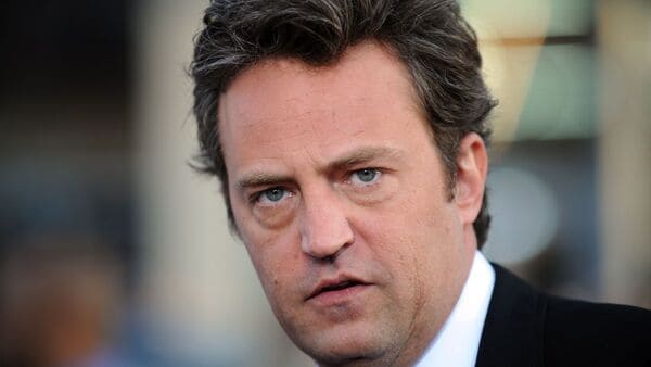 US actor Matthew Perry arrives at the Los Angeles premiere of 17 Again at the Grauman's Chinese Theater in Hollywood, California, April 14, 2009. Kenneth Iwamasa, 61, the personal assistant who repeatedly injected Matthew Perry with ketamine before he died was sentenced to prison on May 27, 2026, becoming the fifth person to face justice over the Friends star's fatal overdose.