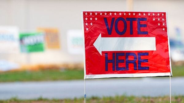 A sign sits outside as voters cast their ballots in the state's Primary Midterm at Metropolitan Library on May 19, 2026 in Atlanta, Georgia. (Image for representational purpose) Megan Varner/Getty Images/AFP