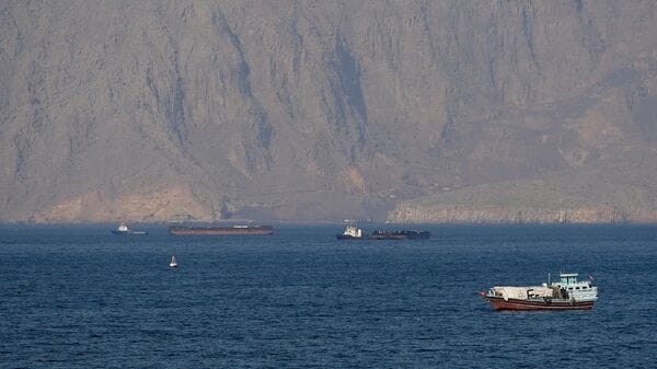 Ships and tankers in the Strait of Hormuz off the coast of Musandam, Oman,