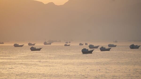 A drone view shows vessels anchored at the Strait of Hormuz, as seen from Musandam, Oman,