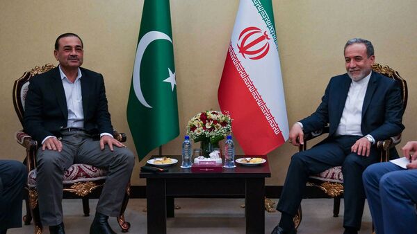 This handout photograph taken and released by the Iranian Foreign Ministry on May 23, 2026 shows Iran's Foreign Minister Abbas Araghchi (R) meeting with Pakistan's Army Chief Syed Asim Munir, in Tehran. (Photo by Iranian Foreign Ministry / AFP)