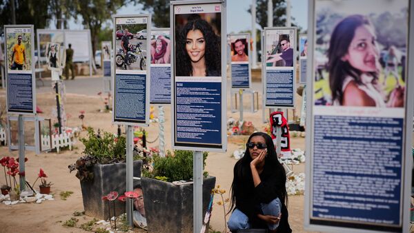People visit the site of the Nova music festival where hundreds of revelers were killed and abducted in the Oct. 7, 2023 Hamas attack, as Israel marks the annual Memorial Day, near Kibbutz Reim in southern Israel Tuesday, April 21, 2026. (AP Photo/Ohad Zwigenberg)