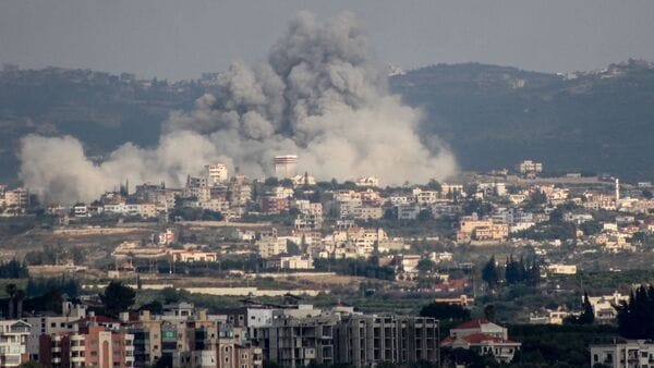 A photograph taken from the Tyre region of southern Lebanon shows smoke rising from the site of Israeli airstrikes that targeted the village of Rmadiyeh in the Tyre district of southern Lebanon on May 26, 2026.