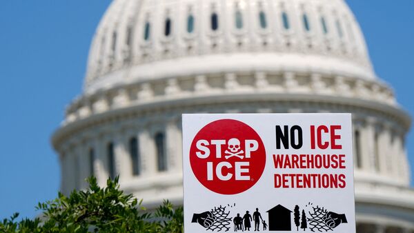A Stop ICE sign is held up during a protest attended by immigrant rights activists and other demonstrators calling on Congress to reject billions in funding for immigration enforcement during the reconciliation process and instead invest in healthcare and food assistance programs, on Capitol Hill in Washington, D.C., U.S., May 20, 2026. REUTERS/Elizabeth Frantz