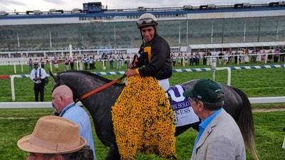 Paco Lopez is lead to the winners circle after he rode Napoleon Solo to win the 151st running of the Preakness Stakes horse race, Saturday, May 16, 2026, at Laurel Park in Laurel, Md. (AP Photo/Julia Demaree Nikhinson) (AP Photo/Julia Demaree Nikhinson)