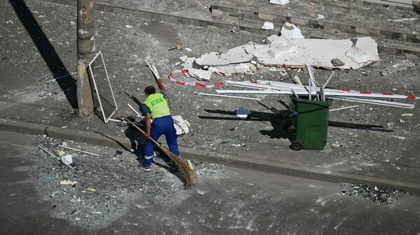 A municipal worker clears debris from the street after a Russian drone struck an apartment building in Galati, western Romania. A Russian drone wounded two people as it struck an apartment building in NATO-member Romania, its defence ministry said on May 29, 2026, the latest spillover from the four-year war into neighbouring states.