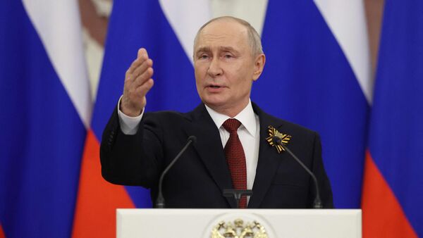 Russian President Vladimir Putin talks to the media following his meetings with foreign delegations at the Kremlin in Moscow