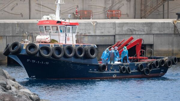 People from the Dutch flagged hantavirus-stricken cruise ship MV Hondius are transferred by boat to the industrial port of Granadilla de Abona on the island of Tenerife in Spain's Canary Islands on May 10, 2026. (Photo by JORGE GUERRERO / AFP)