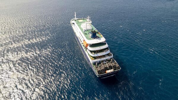 Aerial picture shows a general view of the cruise ship MV Hondius stationary off the port of Praia, the capital of Cape Verde, on May 3, 2026.