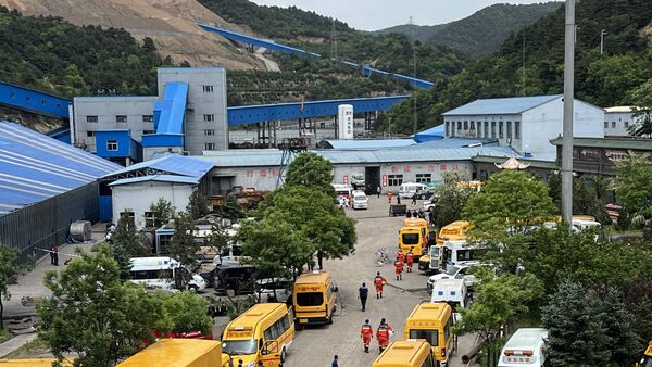 A general view of rescue team members and emergency vehicles arriving at the Liushenyu coal mine after a gas explosion in Changzhi, in northern China's Shanxi province on May 23, 2026.