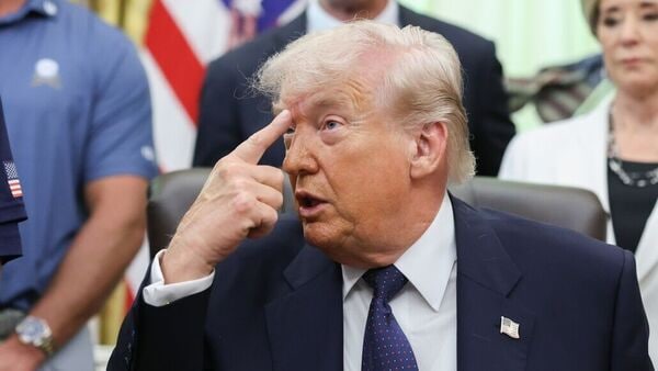 US Iran War LIVE: US President Donald Trump, center, speaks during a memorandum signing in the Oval Office of the White House in Washington, DC, US, on Tuesday, May 5, 2026. Trump is signing a memorandum that brings back the Presidential Fitness Test Award, part of a broader effort by the administration to revamp US public  policies. Photographer: Tom Brenner/The Washington Post/Bloomberg